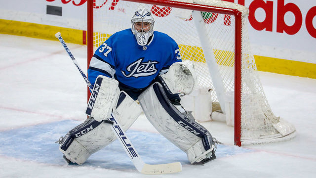 WINNIPEG, MB - FEBRUARY 18: Goaltender Connor Hellebuyck #37 of the Winnipeg Jets guards the net during first period action against the Los Angeles Kings at the Bell MTS Place on February 18, 2020 in Winnipeg, Manitoba, Canada.