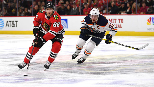 CHICAGO, IL - JANUARY 07: Chicago Blackhawks right wing Patrick Kane (88) controls the puck against Edmonton Oilers center Connor McDavid (97) during the first period during a game between the Chicago Blackhawks and the Edmonton Oilers on January 7, 2018, at the United Center in Chicago, IL.