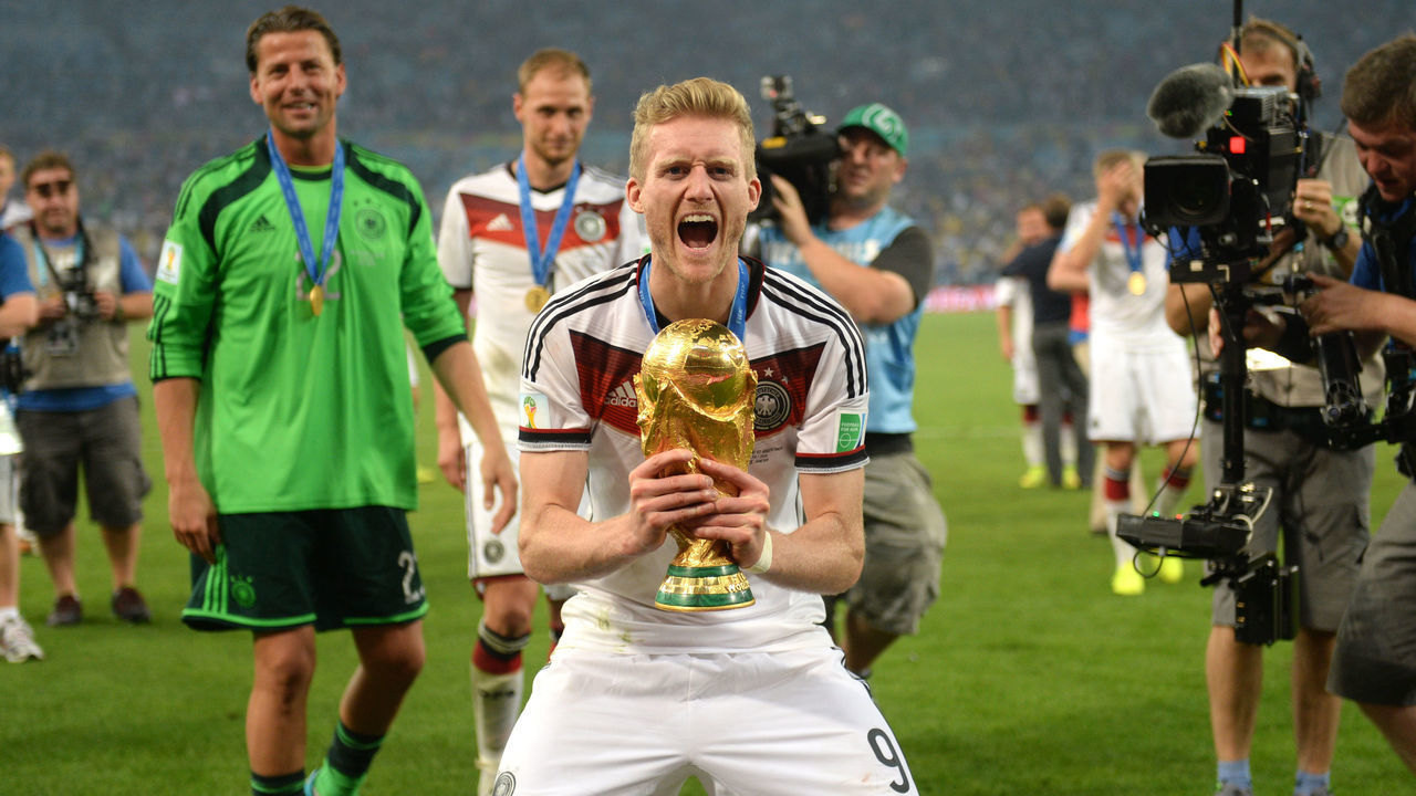 Andre Schuerrle of Germany poses with the World Cup trophy after winning the FIFA World Cup 2014 final soccer match between Germany and Argentina at the Estadio do Maracana in Rio de Janeiro, Brazil, 13 July 2014. Photo: Andreas Gebert/dpa (RESTRICTIONS APPLY: Editorial Use Only, not used in association with any commercial entity - Images must not be used in any form of alert service or push service of any kind including via mobile alert services, downloads to mobile devices or MMS messaging - Images must appear as cstill images and must not emulate match action video footage - No alteration is made to, and no text or image is superimposed over, any published image which: (a) intentionally obscures or removes a sponsor identification image; or (b) adds or overlays the commercial identification of any third party which is not officially associated with the FIFA World Cup) EDITORIAL USE ONLY | usage worldwide
