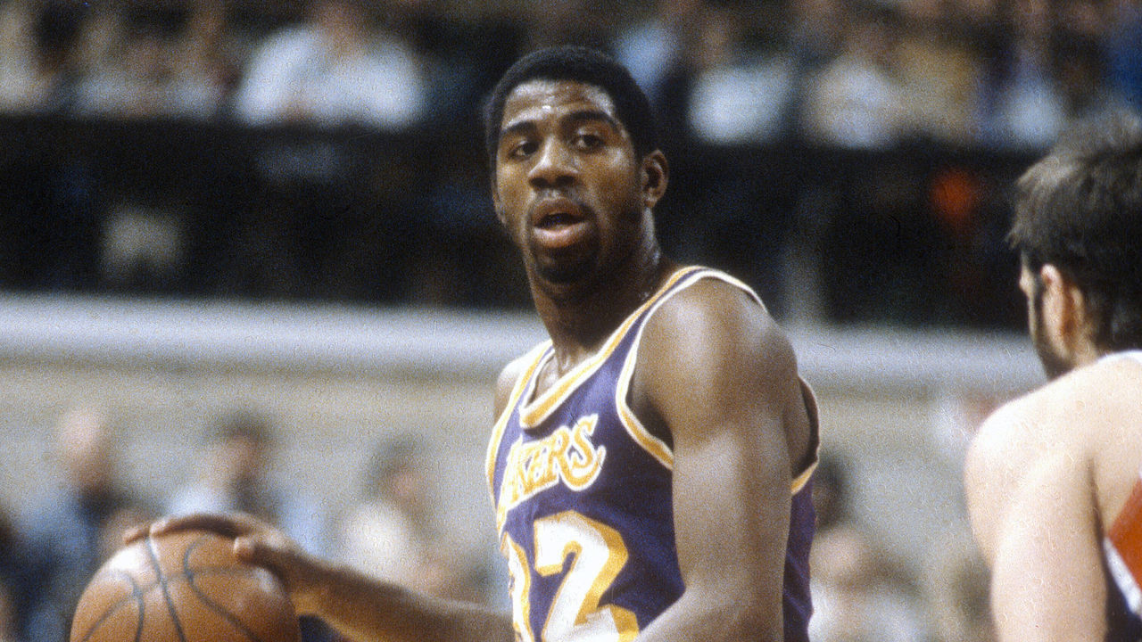 PISCATAWAY, NJ - CIRCA 1980: Earvin Magic Johnson #32 of the Los Angeles Lakers dribbles the ball up court against the New Jersey Nets during an NBA basketball game circa 1980 at the Rutgers Athletic Center in Piscataway, New Jersey. Johnson played for the Lakers from 1979 - 91, 96. *** Local Caption *** Earvin Magic Johnson