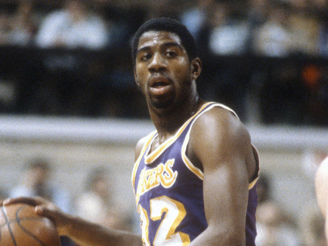 PISCATAWAY, NJ - CIRCA 1980: Earvin Magic Johnson #32 of the Los Angeles Lakers dribbles the ball up court against the New Jersey Nets during an NBA basketball game circa 1980 at the Rutgers Athletic Center in Piscataway, New Jersey. Johnson played for the Lakers from 1979 - 91, 96. *** Local Caption *** Earvin Magic Johnson
