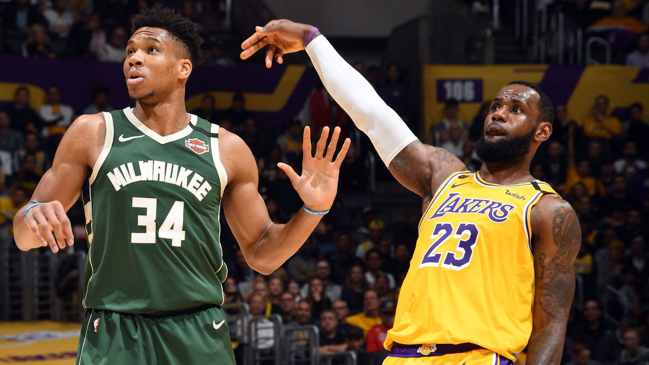 LOS ANGELES, CA - MARCH 6: LeBron James #23 of the Los Angeles Lakers holds the follow through while Giannis Antetokounmpo #34 of the Milwaukee Bucks plays defense on March 6, 2020 at STAPLES Center in Los Angeles, California. NOTE TO USER: User expressly acknowledges and agrees that, by downloading and/or using this Photograph, user is consenting to the terms and conditions of the Getty Images License Agreement. Mandatory Copyright Notice: Copyright 2020 NBAE