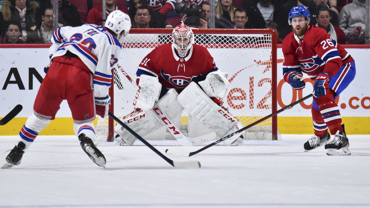 MONTREAL, QC - FEBRUARY 27: Goaltender Carey Price #31 and teammate Jeff Petry #26 of the Montreal Canadiens defend the net against Adam Fox #23 of the New York Rangers during the second period at the Bell Centre on February 27, 2020 in Montreal, Canada. The New York Rangers defeated the Montreal Canadiens 5-2.