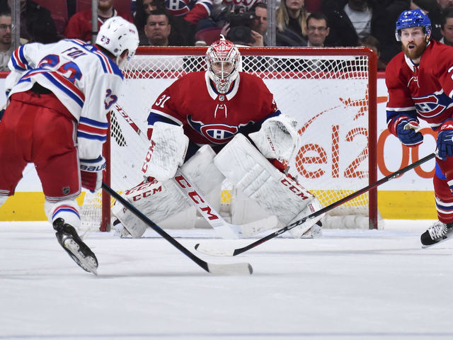 MONTREAL, QC - FEBRUARY 27: Goaltender Carey Price #31 and teammate Jeff Petry #26 of the Montreal Canadiens defend the net against Adam Fox #23 of the New York Rangers during the second period at the Bell Centre on February 27, 2020 in Montreal, Canada. The New York Rangers defeated the Montreal Canadiens 5-2.
