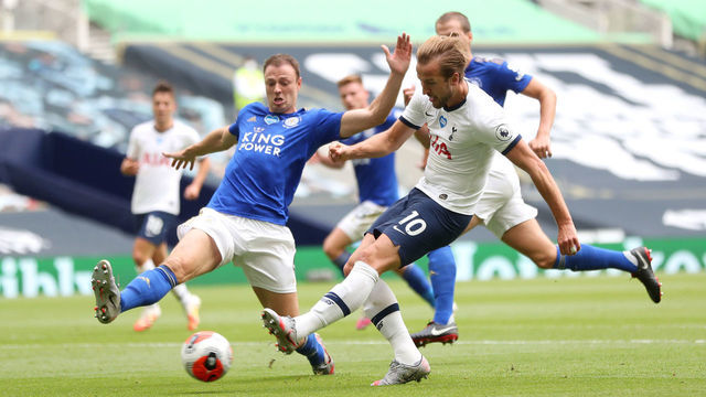 LONDON, ENGLAND - JULY 19: Harry Kane of Tottenham Hotspur scores his teams second goal during the Premier League match between Tottenham Hotspur and Leicester City at Tottenham Hotspur Stadium on July 19, 2020 in London, England. Football Stadiums around Europe remain empty due to the Coronavirus Pandemic as Government social distancing laws prohibit fans inside venues resulting in all fixtures being played behind closed doors.