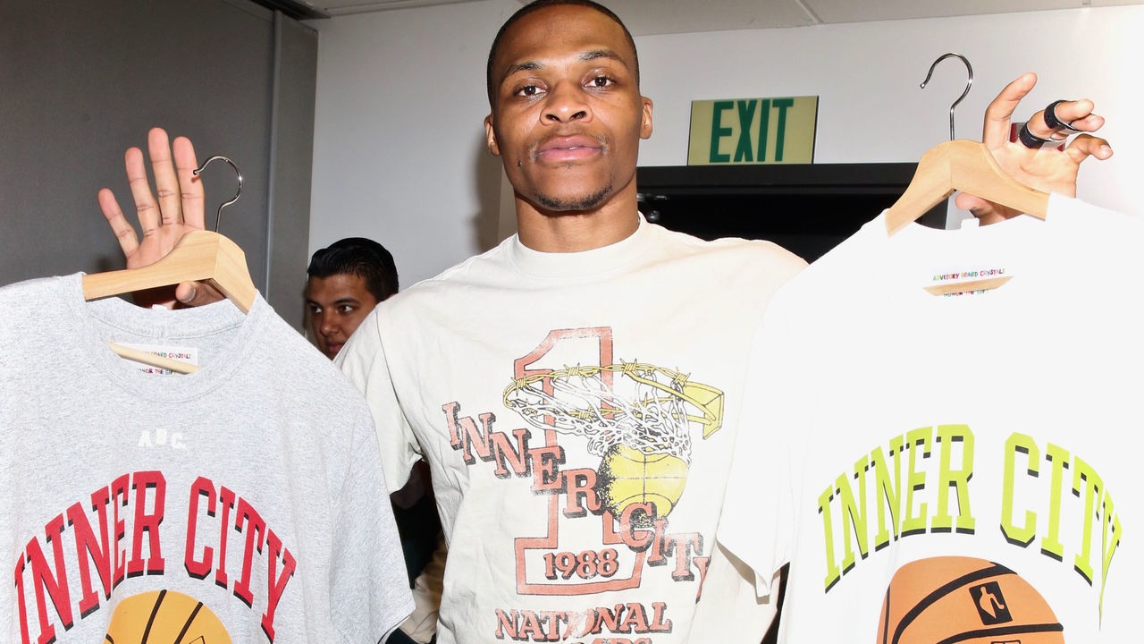 LOS ANGELES, CALIFORNIA - MAY 30: NBA's Russell Westbrook poses with his T-Shirts at Inner City Arts on May 30, 2019 in Los Angeles, California.