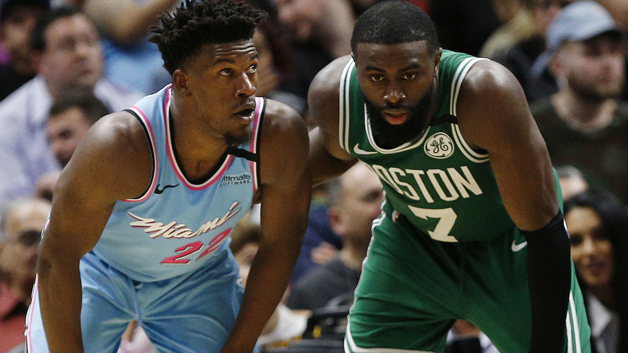 MIAMI, FLORIDA - JANUARY 28: Jimmy Butler #22 of the Miami Heat and Jaylen Brown #7 of the Boston Celtics look on during the second half at American Airlines Arena on January 28, 2020 in Miami, Florida. NOTE TO USER: User expressly acknowledges and agrees that, by downloading and/or using this photograph, user is consenting to the terms and conditions of the Getty Images License Agreement.