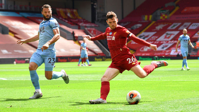 LIVERPOOL, ENGLAND - JULY 11: Erik Pieters of Burnley looks to block a shot from Andy Robertson of Liverpool during the Premier League match between Liverpool FC and Burnley FC at Anfield on July 11, 2020 in Liverpool, England. Football Stadiums around Europe remain empty due to the Coronavirus Pandemic as Government social distancing laws prohibit fans inside venues resulting in all fixtures being played behind closed doors.
