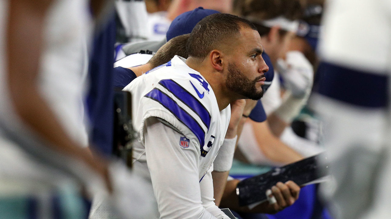 ARLINGTON, TEXAS - NOVEMBER 28: Dak Prescott #4 of the Dallas Cowboys sits on the bench in the fourth quarter of the game against the Buffalo Bills at AT&T Stadium on November 28, 2019 in Arlington, Texas.