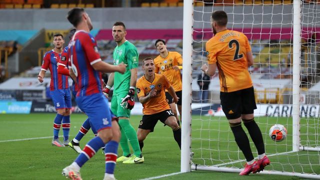 Wolverhampton Wanderers' Portuguese midfielder Daniel Podence (C) celebrates scoring the opening goal during the English Premier League football match between Wolverhampton Wanderers and Crystal Palace at the Molineux stadium in Wolverhampton, central England on July 20, 2020.
