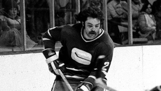 BOSTON, MA - 1970's: Jack Mcilhargey #29 of the Vancouver Canucks skates with puck against the Boston Bruins at Boston Garden.