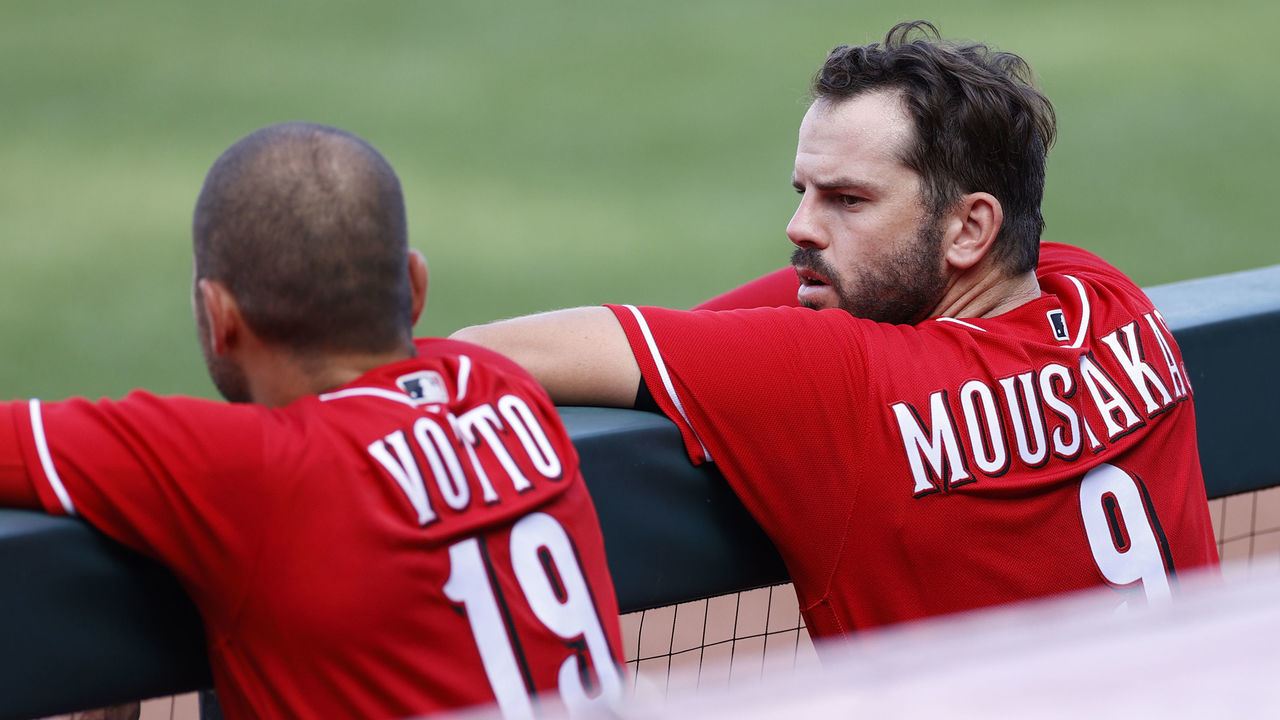 CINCINNATI, OH - JULY 14: Mike Moustakas #9 of the Cincinnati Reds talks to Joey Votto #19 in the third inning of a team scrimmage at Great American Ball Park on July 14, 2020 in Cincinnati, Ohio.
