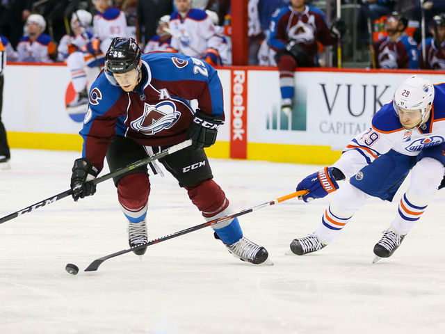 DENVER, CO - NOVEMBER 23: Leon Draisaitl #29 of the Edmonton Oilers pokes the puck away from Nathan MacKinnon #29 of the Colorado Avalanche during a power play in the second period at Pepsi Center on November 23, 2016 in Denver, Colorado.