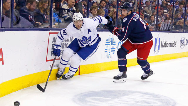 COLUMBUS, OH - DECEMBER 28: John Tavares #91 of the Toronto Maple Leafs and Zach Werenski #8 of the Columbus Blue Jackets chase after a loose puck during the first period of the game on December 28, 2018 at Nationwide Arena in Columbus, Ohio.