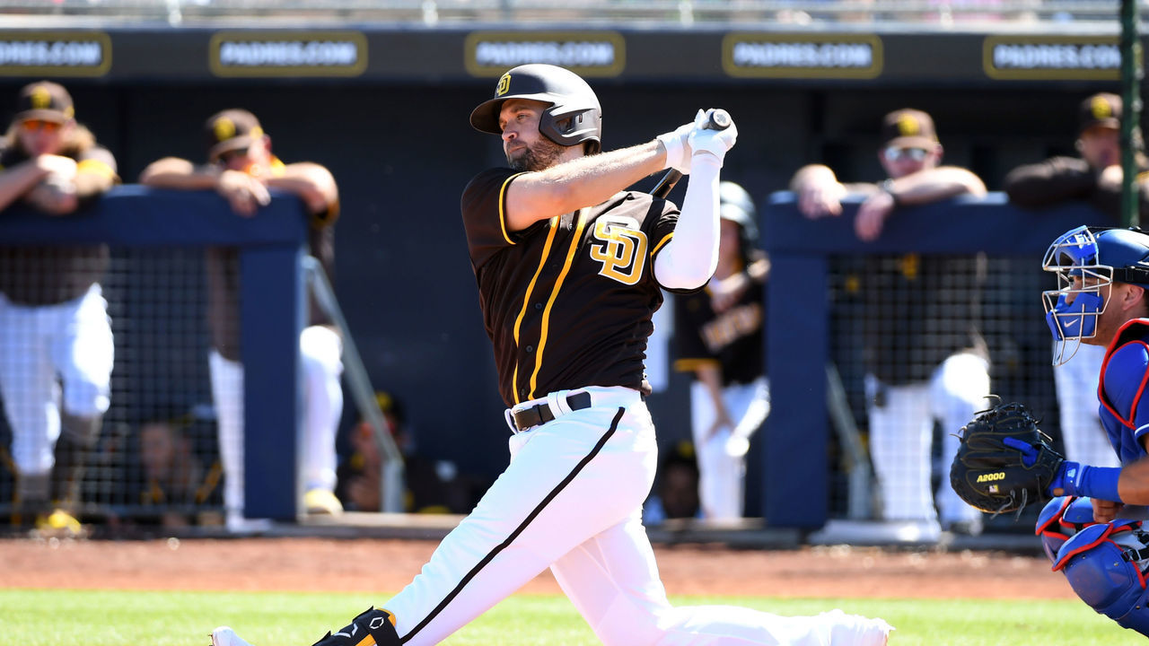 PEORIA, ARIZONA - MARCH 09: Brian Dozier #25 of the San Diego Padres follows through on a swing against the Los Angeles Dodgers during a spring training game at Peoria Stadium on March 09, 2020 in Peoria, Arizona.