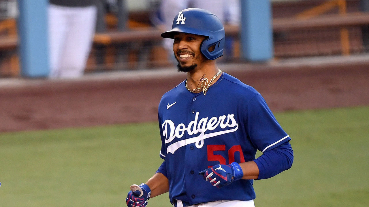 LOS ANGELES, CALIFORNIA - JULY 14: Mookie Betts #50 of the Los Angeles Dodgers smiles in reaction to his homerun during the Los Angeles Dodgers summer camp workout in preparation for the 2020 season amidst the coronavirus (COVID-19) pandemic at Dodger Stadium on July 14, 2020 in Los Angeles, California.
