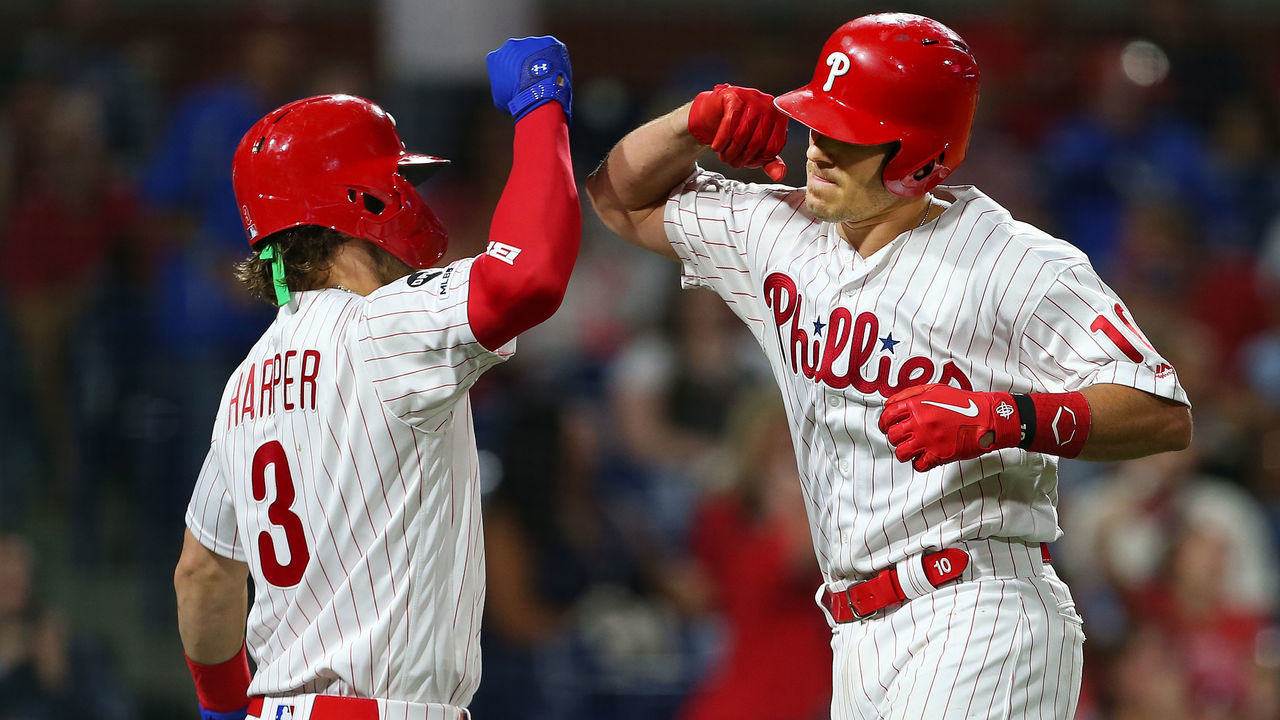 PHILADELPHIA, PA - AUGUST 28: J.T. Realmuto #10 of the Philadelphia Phillies is congratulated by Bryce Harper #3 after hitting a home run against the Pittsburgh Pirates during the sixth inning of a game at Citizens Bank Park on August 28, 2019 in Philadelphia, Pennsylvania.