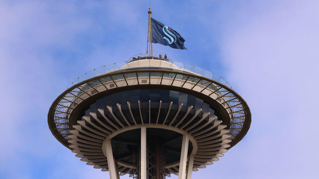 SEATTLE, WASHINGTON - JULY 23: A general view of the Space Needle as the Seattle Kraken team flag is hung from above on July 23, 2020 in Seattle, Washington. The NHL revealed the franchise's new team name today.