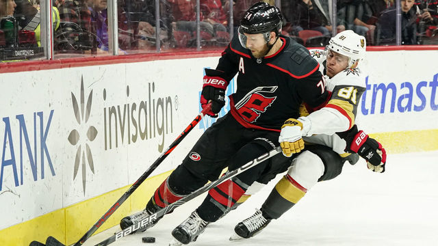 RALEIGH, NC - JANUARY 31: Vegas Golden Knights Left Wing Jonathan Marchessault (81) runs Carolina Hurricanes Defenceman Jaccob Slavin (74) into the boards during a game between the Carolina Hurricanes and the Las Vegas Golden Knights on January 31, 2020 at the PNC Arena in Raleigh, NC.