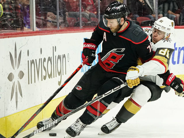 RALEIGH, NC - JANUARY 31: Vegas Golden Knights Left Wing Jonathan Marchessault (81) runs Carolina Hurricanes Defenceman Jaccob Slavin (74) into the boards during a game between the Carolina Hurricanes and the Las Vegas Golden Knights on January 31, 2020 at the PNC Arena in Raleigh, NC.