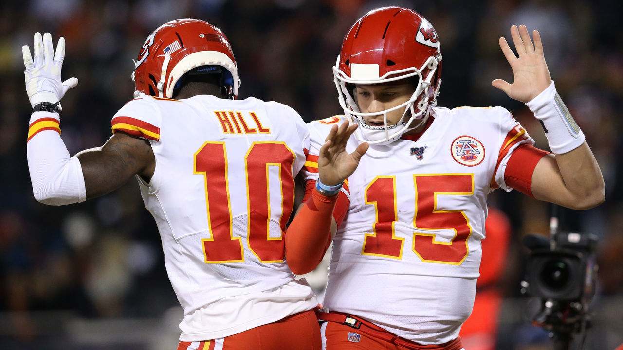 CHICAGO, ILLINOIS - DECEMBER 22: Quarterback Patrick Mahomes #15 of the Kansas City Chiefs celebrates with teammate wide receiver Tyreek Hill #10 after scoring a touchdown against the Chicago Bears in the first quarter of the game at Soldier Field on December 22, 2019 in Chicago, Illinois.