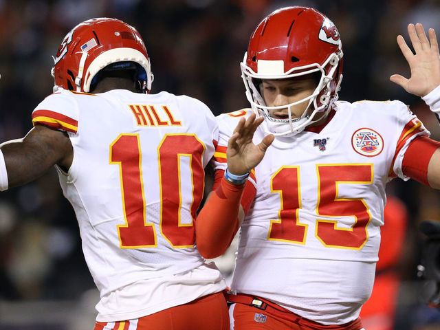 CHICAGO, ILLINOIS - DECEMBER 22: Quarterback Patrick Mahomes #15 of the Kansas City Chiefs celebrates with teammate wide receiver Tyreek Hill #10 after scoring a touchdown against the Chicago Bears in the first quarter of the game at Soldier Field on December 22, 2019 in Chicago, Illinois.