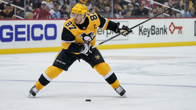 PITTSBURGH, PA - MARCH 07: Pittsburgh Penguins Center Sidney Crosby (87) lines up a shot during the first period in the NHL game between the Pittsburgh Penguins and the Washington Capitals on March 7, 2020, at PPG Paints Arena in Pittsburgh, PA.