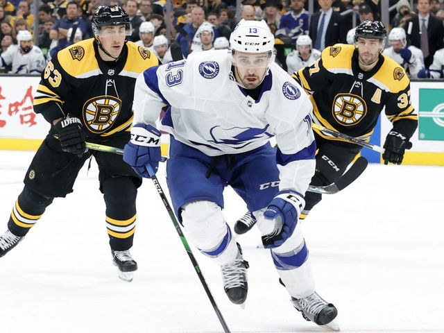 BOSTON, MA - MARCH 07: Tampa Bay Lightning center Cedric Paquette (13) chases the puck during a game between the Boston Bruins and the Tampa Bay Lightning on March 7, 2020 at TD Garden in Boston, Massachusetts.