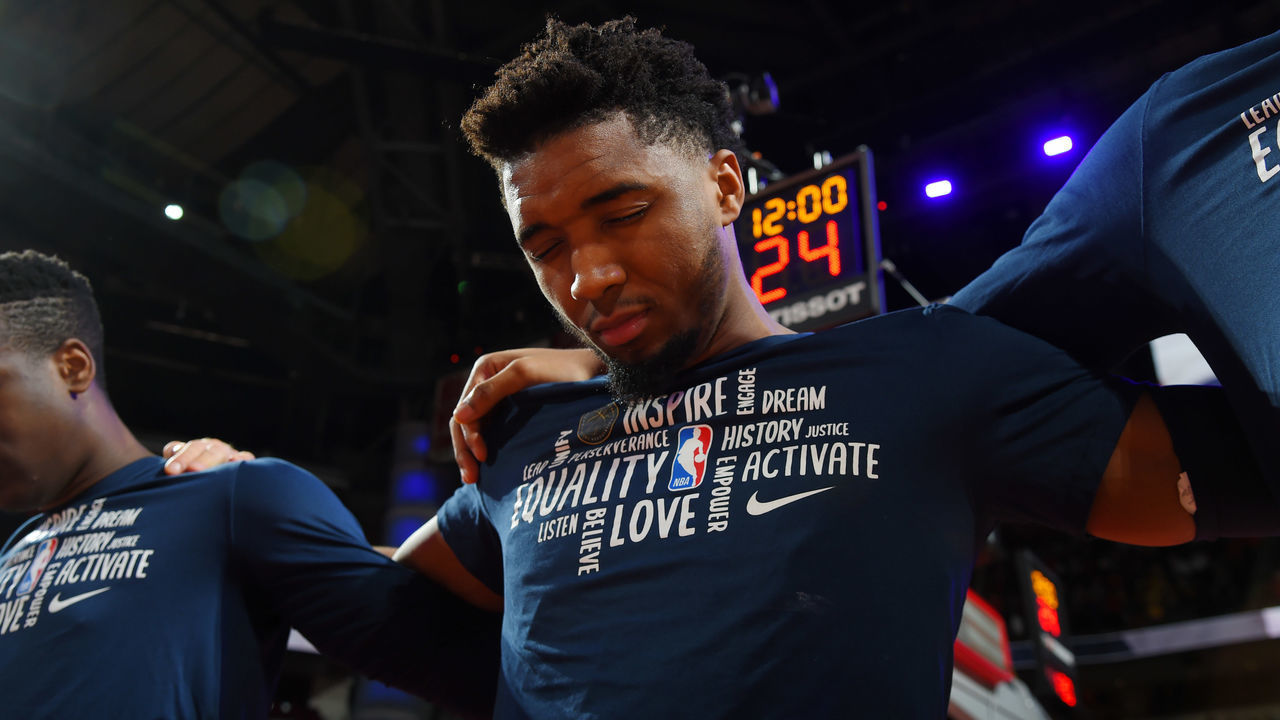 HOUSTON, TX - FEBRUARY 9: Donovan Mitchell #45 of the Utah Jazz stands for the National Anthem prior to the game against the Houston Rockets on February 9, 2020 at the Toyota Center in Houston, Texas. Mandatory Copyright Notice: Copyright 2020 NBAE