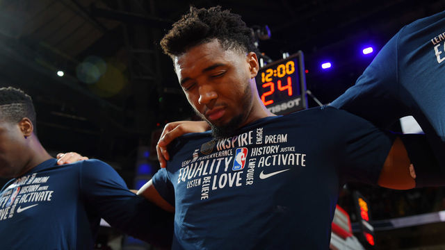 HOUSTON, TX - FEBRUARY 9: Donovan Mitchell #45 of the Utah Jazz stands for the National Anthem prior to the game against the Houston Rockets on February 9, 2020 at the Toyota Center in Houston, Texas. Mandatory Copyright Notice: Copyright 2020 NBAE