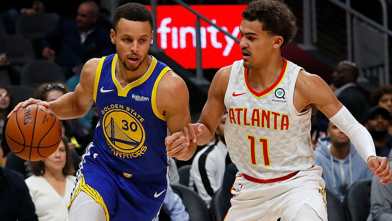 ATLANTA, GA - DECEMBER 03: Stephen Curry #30 of the Golden State Warriors drives against Trae Young #11 of the Atlanta Hawks at State Farm Arena on December 3, 2018 in Atlanta, Georgia.
