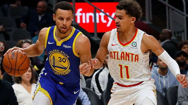 ATLANTA, GA - DECEMBER 03: Stephen Curry #30 of the Golden State Warriors drives against Trae Young #11 of the Atlanta Hawks at State Farm Arena on December 3, 2018 in Atlanta, Georgia.