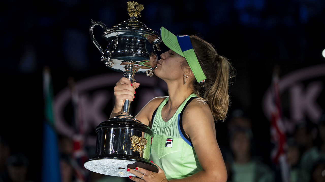 MELBOURNE, AUSTRALIA - FEBRUARY 01: Sofia Kenin of the United States celebrates with the trophy after winning the women's singles final match against Garbine Muguruza of Spain on day thirteen of the 2020 Australian Open at Melbourne Park on February 01, 2020 in Melbourne, Australia.