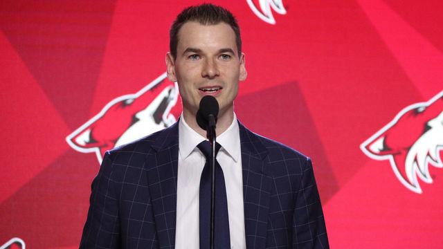 VANCOUVER, BRITISH COLUMBIA - JUNE 21: General manager John Chayka of the Arizona Coyotes speaks onstage during Rounds 2-7 of the 2019 NHL Draft at Rogers Arena on June 22, 2019 in Vancouver, Canada.