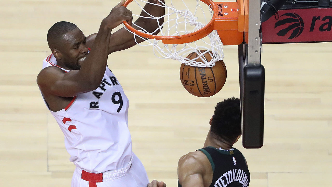 TORONTO, ON- MAY 25 - Toronto Raptors center Serge Ibaka (9) dunks over Milwaukee Bucks forward Giannis Antetokounmpo (34) as the Toronto Raptors play the Milwaukee Bucks in game six of the NBA Eastern Conference Final in Toronto. May 25, 2019. (Steve Russell/Toronto Star via Getty Images)