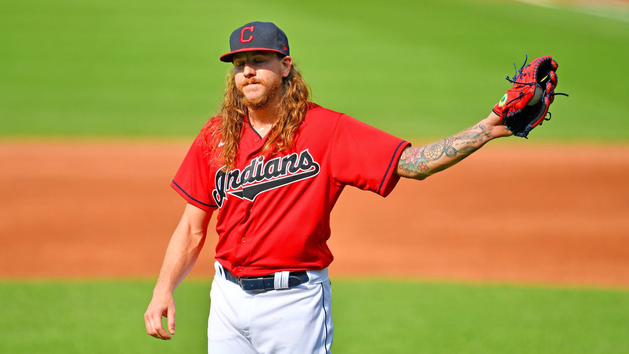 CLEVELAND, OHIO - JULY 25: Starting pitcher Mike Clevinger #52 of the Cleveland Indians reacts after giving up a solo homer to Salvador Perez #13 of the Kansas City Royals during the first inning at Progressive Field on July 25, 2020 in Cleveland, Ohio. The 2020 season had been postponed since March due to the COVID-19 pandemic.