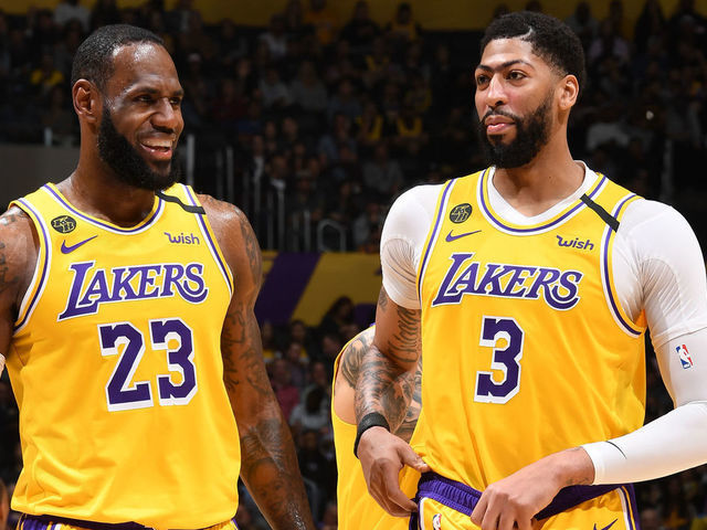 LOS ANGELES, CA - MARCH 3: LeBron James #23, and Anthony Davis #3 of the Los Angeles Lakers smile during the game against the Philadelphia 76ers on March 03, 2020 at STAPLES Center in Los Angeles, California. NOTE TO USER: User expressly acknowledges and agrees that, by downloading and/or using this Photograph, user is consenting to the terms and conditions of the Getty Images License Agreement. Mandatory Copyright Notice: Copyright 2020 NBAE