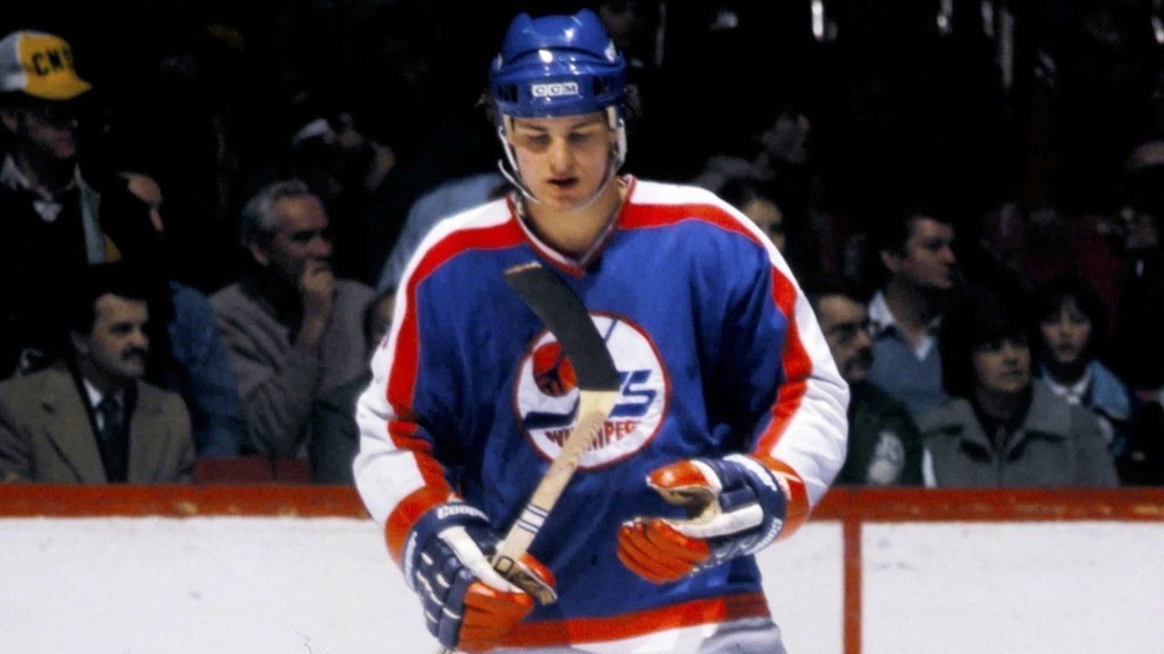 MONTREAL 1980's: Dale Hawerchuk #10 of the Winnipeg Jets skates against the Montreal Canadiens in the 1980's at the Montreal Forum in Montreal, Quebec, Canada.