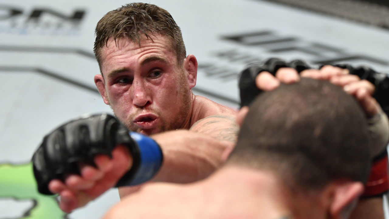 ABU DHABI, UNITED ARAB EMIRATES - JULY 26: (L-R) Darren Till of England punches Robert Whittaker of New Zealand in their middleweight fight during the UFC Fight Night event inside Flash Forum on UFC Fight Island on July 26, 2020 in Yas Island, Abu Dhabi, United Arab Emirates.
