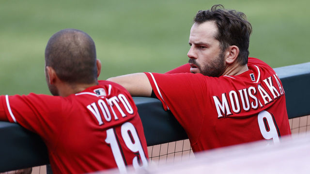 CINCINNATI, OH - JULY 14: Mike Moustakas #9 of the Cincinnati Reds talks to Joey Votto #19 in the third inning of a team scrimmage at Great American Ball Park on July 14, 2020 in Cincinnati, Ohio.