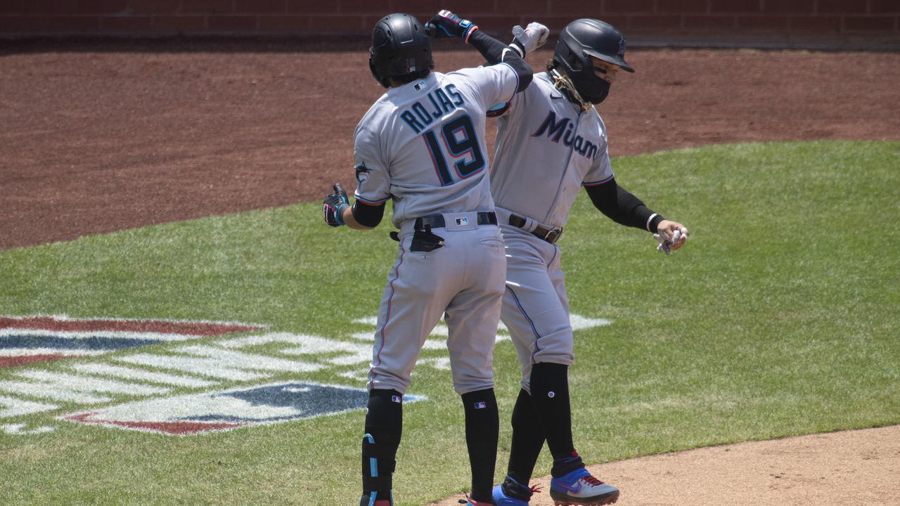 PHILADELPHIA, PA - JULY 26: Miguel Rojas #19 of the Miami Marlins celebrates with Isan Diaz #1 after hitting a three run home run in the top of the second inning against the Philadelphia Phillies at Citizens Bank Park on July 26, 2020 in Philadelphia, Pennsylvania.