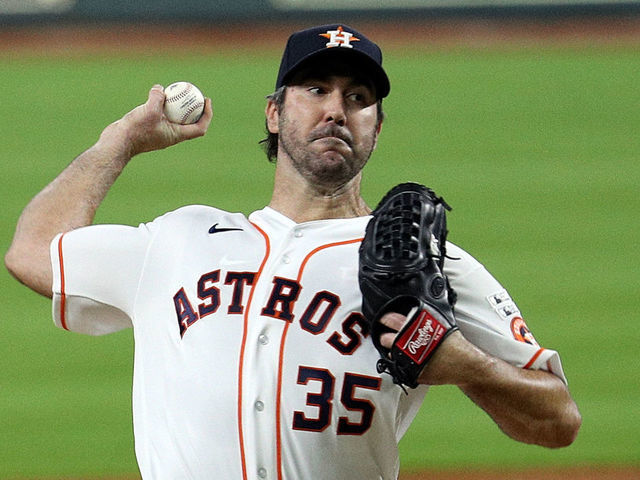 HOUSTON, TEXAS - JULY 24: Justin Verlander #35 of the Houston Astros pitches in the first inning against the Seattle Mariners during Opening Day at Minute Maid Park on July 24, 2020 in Houston, Texas. The 2020 season had been postponed since March due to the COVID-19 pandemic.