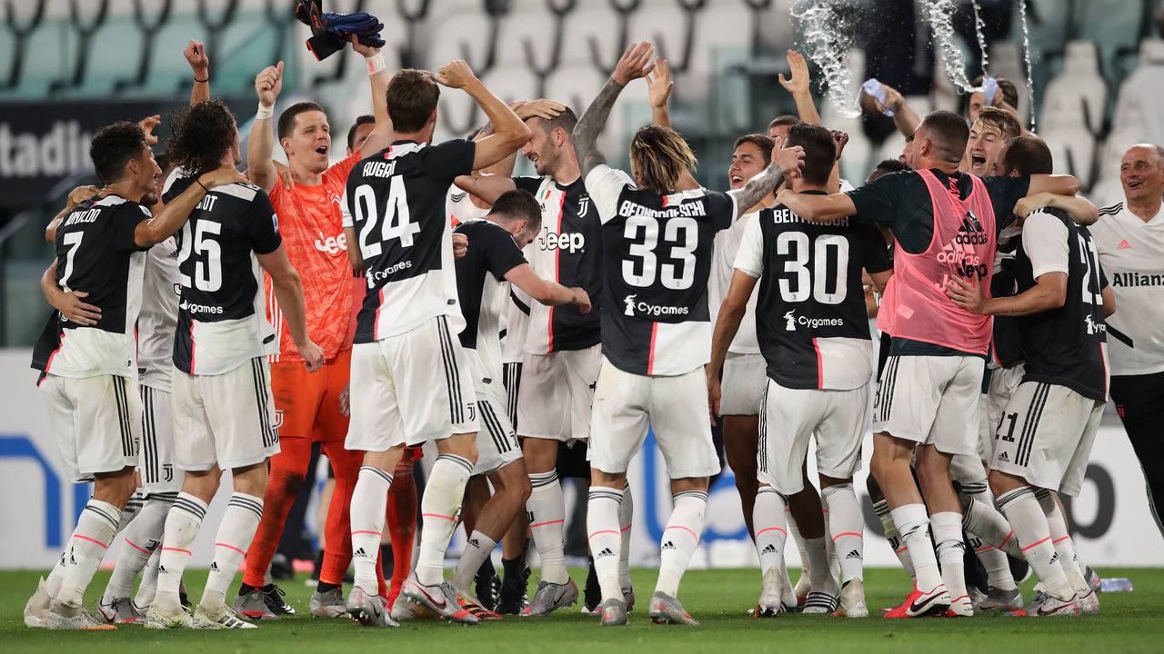 TURIN, ITALY - JULY 26: Juventus players celebrate after the final whistle as they are confirmed Champions for the ninth season in succession following the 2-0 victory in during the Serie A match between Juventus and UC Sampdoria at Allianz Stadium on July 26, 2020 in Turin, Italy.