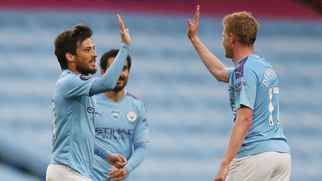 MANCHESTER, ENGLAND - JULY 08: David Silva of Manchester City celebrates with his team after he scores his sides fourth goal from a free kick during the Premier League match between Manchester City and Newcastle United at Etihad Stadium on July 08, 2020 in Manchester, England. Football Stadiums around Europe remain empty due to the Coronavirus Pandemic as Government social distancing laws prohibit fans inside venues resulting in all fixtures being played behind closed doors.
