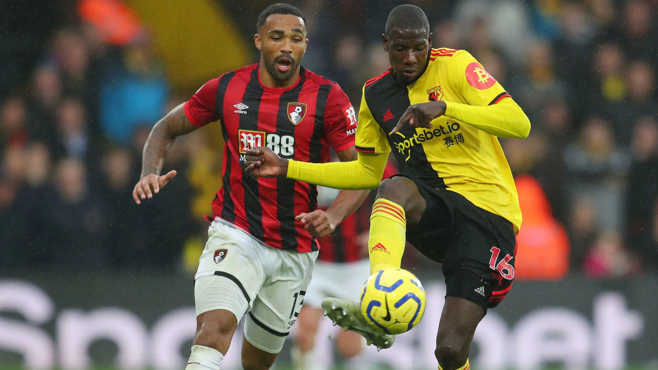 WATFORD, ENGLAND - OCTOBER 26: Callum Wilson of AFC Bournemouth battles for possession with Abdoulaye Doucoure of Watford during the Premier League match between Watford FC and AFC Bournemouth at Vicarage Road on October 26, 2019 in Watford, United Kingdom.