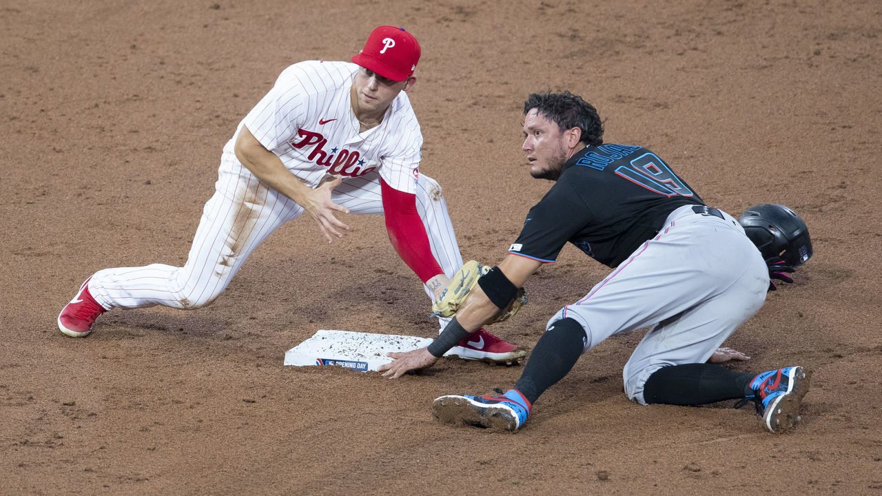 PHILADELPHIA, PA - JULY 24: Miguel Rojas #19 of the Miami Marlins steals second base past Scott Kingery #4 of the Philadelphia Phillies in the top of the third inning during Opening Day at Citizens Bank Park on July 24, 2020 in Philadelphia, Pennsylvania. The 2020 season had been postponed since March due to the COVID-19 pandemic. The Marlins defeated the Phillies 5-2.