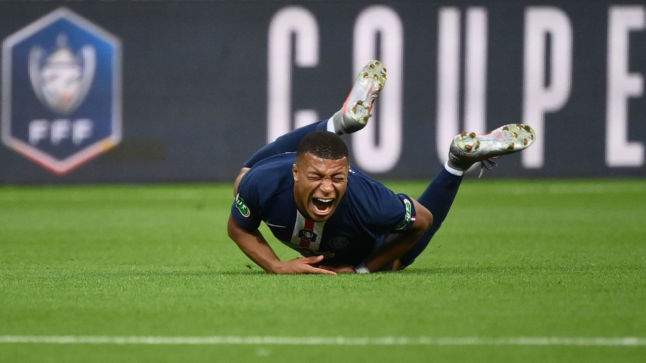 TOPSHOT - Paris Saint-Germain's French forward Kylian Mbappe reacts as he is fouled during the French Cup final football match between Paris Saint-Germain (PSG) and Saint-Etienne (ASSE) on July 24, 2020, at the Stade de France in Saint-Denis, outside Paris.