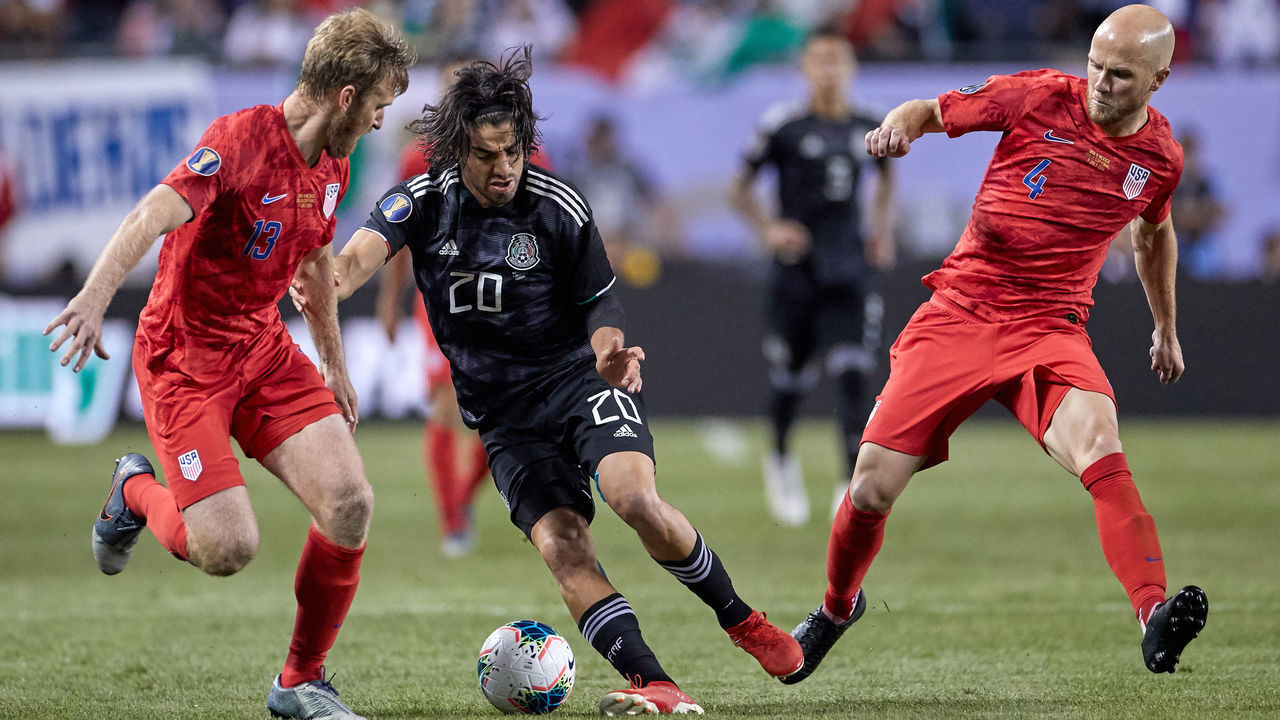 CHICAGO, IL - JULY 07: Mexico forward Rodolfo Pizarro (20) battles with United States defender Tim Ream (13) and United States midfielder Michael Bradley (4) during the CONCACAF Gold Cup final match between the United States and Mexico on July 07, 2019, at Soldier Field in Chicago, IL.