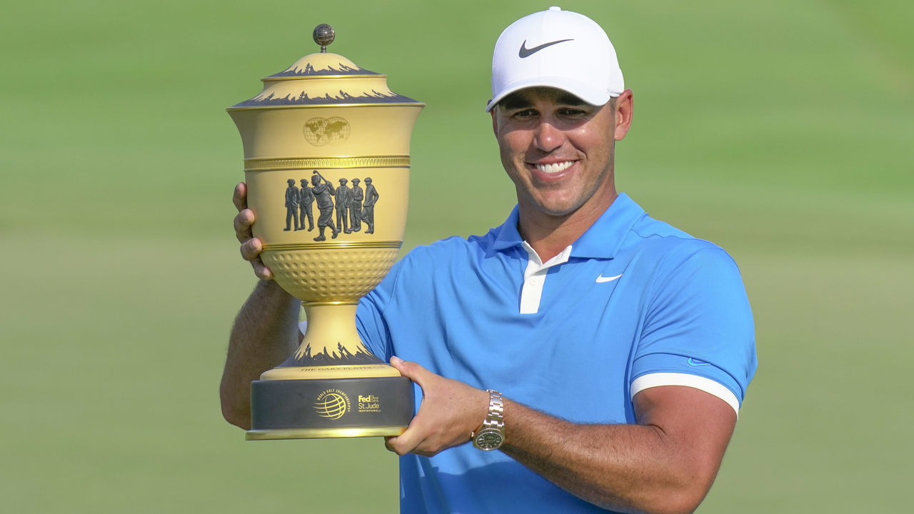 MEMPHIS, TN - JULY 28: Brooks Koepka holding the trophy after winning the World Golf Championships - FedEx St. Jude Invitational on July 28, 2019 at TPC Southwind in Memphis, Tennessee.