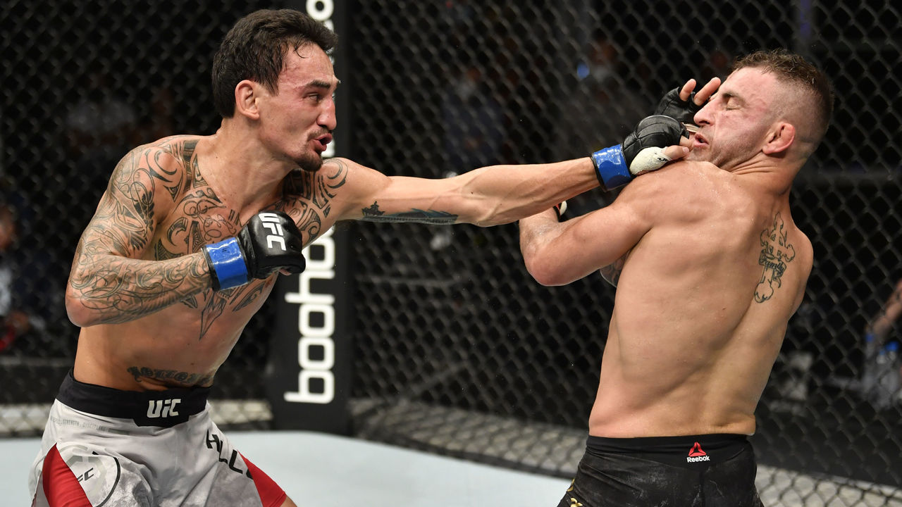 ABU DHABI, UNITED ARAB EMIRATES - JULY 12: (L-R) Max Holloway punches Alexander Volkanovski of Australia in their UFC featherweight championship fight during the UFC 251 event at Flash Forum on UFC Fight Island on July 12, 2020 on Yas Island, Abu Dhabi, United Arab Emirates.